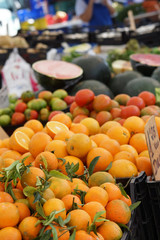 Ripe mandarins and oranges are sold on the market in Spain