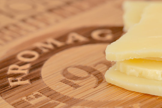 Wooden cheeseboard with cheese