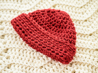 Red Crocheted Baby Cap with Brim Folded Up