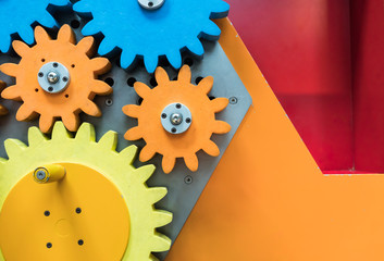 Colorful wooden gears with twisting bar for kid activity and learning
