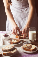 Obraz na płótnie Canvas Serving a Slice of Cake by Hand, toned photo