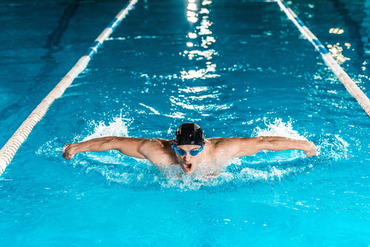 Professional Swimmer In Pool