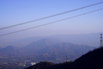 Transmission line and mountains background.
