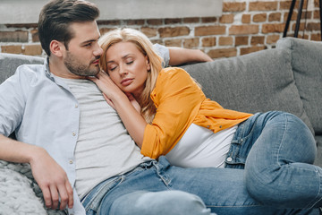 couple relaxing on couch