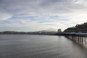 Llandudno Pier and Sea Front at Dusk. Llandudno is famous for holidays with its Victorian era hotels and pier