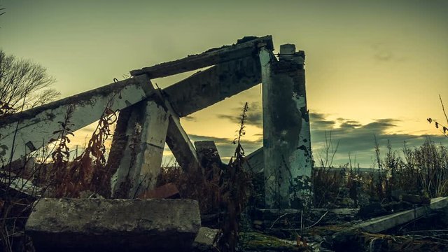 The post-apocalyptic world.Apocalyptic landscape. The concrete beams of a ruined house at sunset