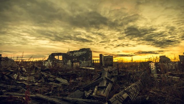 The post-apocalyptic world.The ruins of the destroyed buildings at sunset