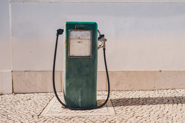 Vintage old gasoline pump and oil dispenser