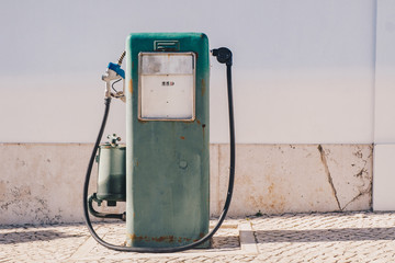 Vintage old gasoline pump and oil dispenser