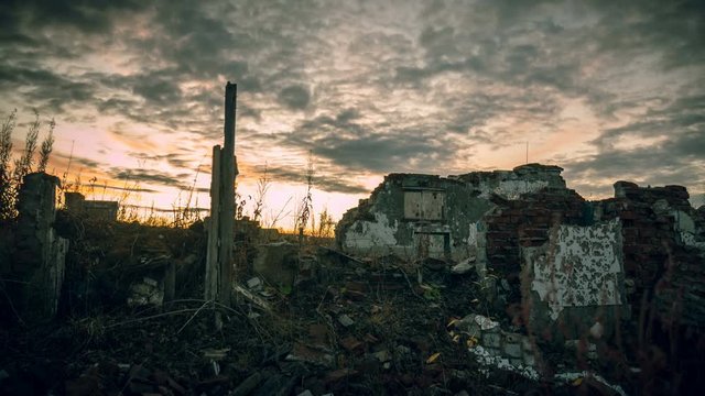 The post-apocalyptic world.Dramatic dawn sky over the walls of a ruined house