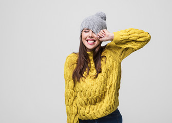 Beautiful woman winter portrait. Smiling girl wearing warm clothes having fun