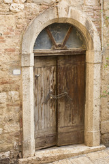 Fototapeta na wymiar Ancient wooden and stone door