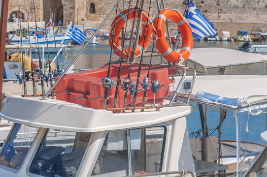 Fishing equipment on boat docked on marina in Greek town Rhodes