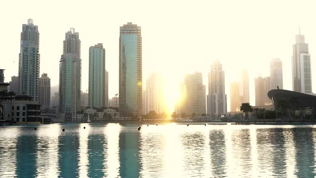 view of the skyscrapers of Dubai at sunset, across the water, static