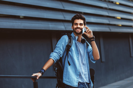 Young Handsome Man Talking On The Phone Outdoor