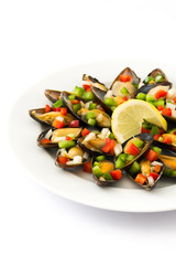 Steamed mussels with peppers and onion isolated on white background