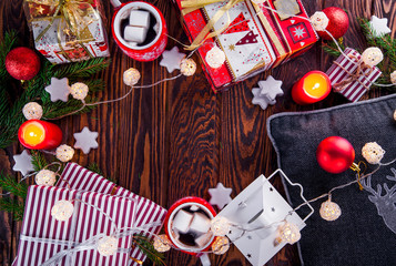 Christmas background including gift boxes, hot chocolate, fir branches and other decorations