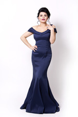 brunette wearing navy long evening gown