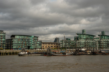 Picturesque East London buildings viewed from the Thames river