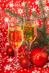 Fototapeta na wymiar glasses of champagne and Christmas decorations