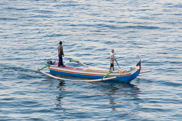 Fototapeta premium traditional boat with two fishermen