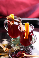 Christmas mulled wine in water, mulled wine with cinnamon and anise, drink with honey, mulled wine glass with seashells in water, retro style, drink with orange slices, pop art style