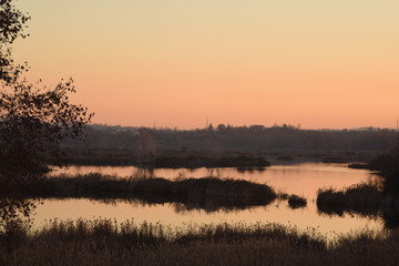 Sunset in the ponds of the Torbiere at the border of Lake Iseo in Brescia