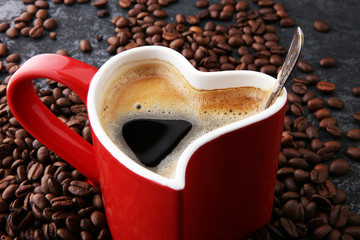 Red Heart Coffee cup and beans on table