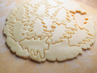 Festive Christmas cookies. Background of shortbread in the shape of Christmas trees.
