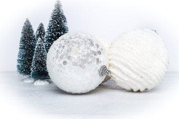 Miniature evergreen trees and Christmas balls