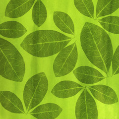 Artistic green background with pencil-shaped leaves