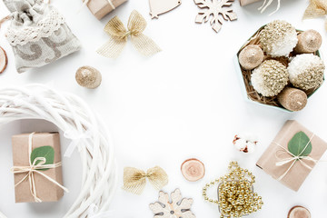 christmas toys and craft boxes on white background. flat lay, top view