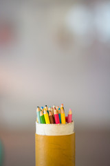 Obraz premium colored pencils in a can with negative space around and blurred background