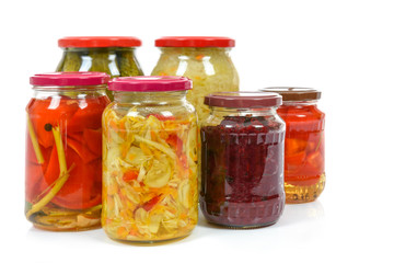 Fototapeta na wymiar Jars with variety of homemade pickled vegetables isolated on a white background.