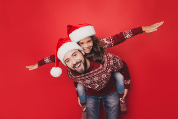 Adorable sweet guy dad with small cute girl fooling around, excited in knitted cute traditional x...