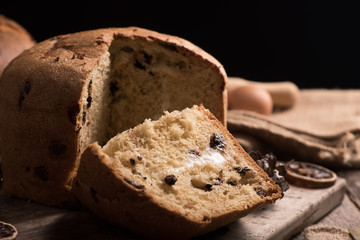 Homemade Panettone. Italian Christmas Cake on a rustic wooden table