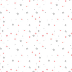 Seamless vector pattern with colored stars of various sizes on white background.