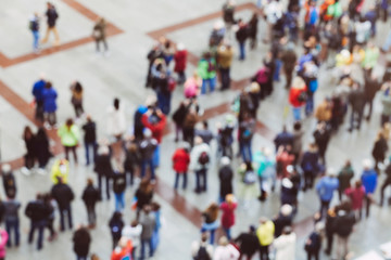 crowd of people on the street from above, blurred people