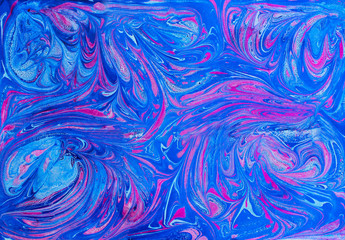 Abstract blue and pink pattern. Paper marbling in traditional turkish art style - ebru. Colorful...