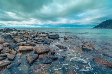 Beautiful wilderness, rocky beach, view of the fjord. Lofoten islands, Norway.