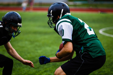 Football players offense defense in action