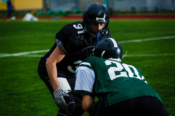 Fototapeta premium Football players offense defense in action
