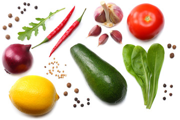 healthy food. mix of avocado, lemon, tomato, red onion, garlic, sweet bell pepper and rucola leaves isolated on white background top view