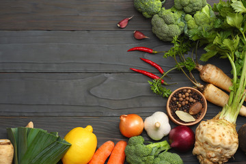 Fresh vegetables on dark wooden background. Mockup for menu or recipe. Top view with copy space