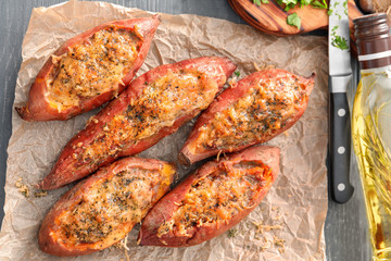 Yummy stuffed sweet potato on kitchen table