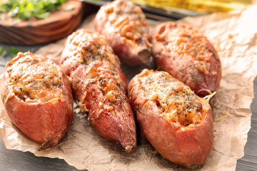 Yummy stuffed sweet potato on kitchen table