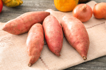 Raw sweet potato on table