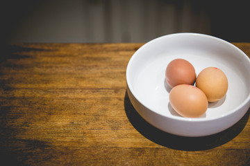 3 eggs in a bowl on kitchen work surface