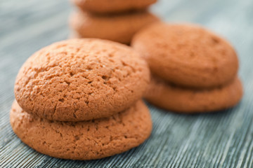 Tasty oatmeal cookies on wooden table, closeup