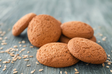 Tasty oatmeal cookies on wooden table
